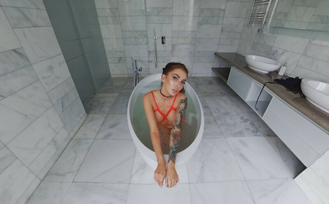 MeganQ Sizzles in Red Ribbon Striptease - Image 1